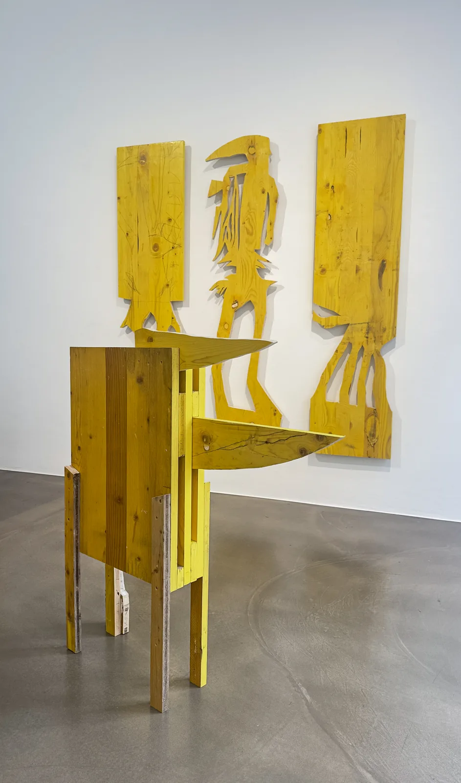 Detail view, Cosmic Trigger – Respawn, yellow wood sculpture with cantilevered blades