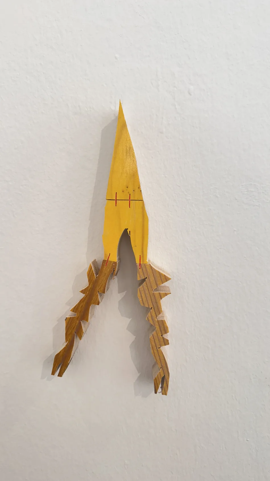 Detail of a yellow flame-shaped formwork-timber sculptural element, Ernst Koslitsch, Cosmic Trigger – Respawn