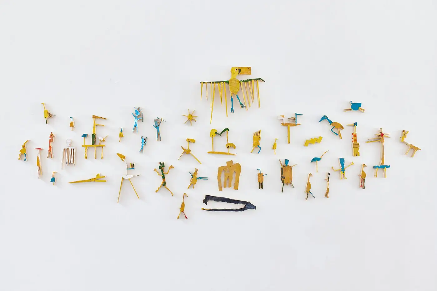 The First 5000 Years, wall sculpture of 38 small painted woodcuts