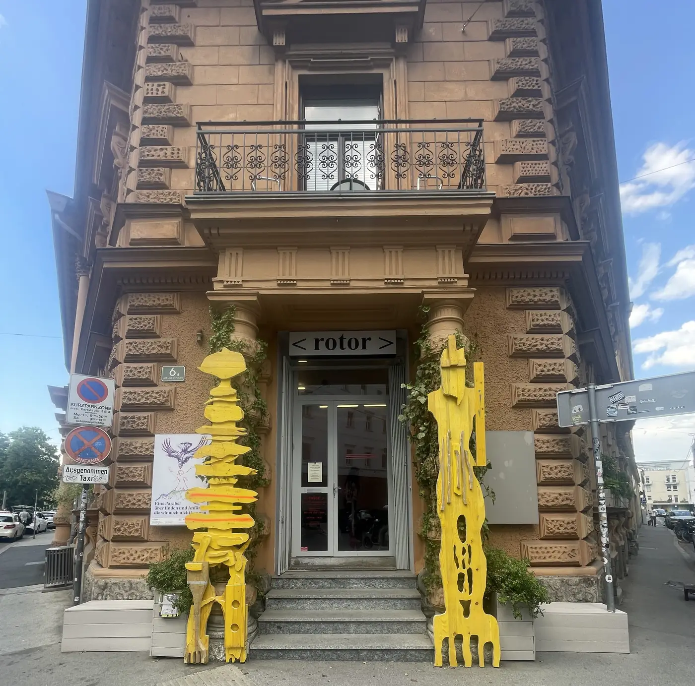 Entrance view, rotor Graz, with both Echo Keepers sculptures flanking the door