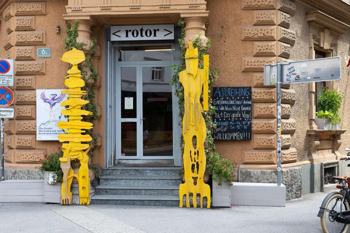 Echo Keepers 1 + 2, two yellow sculptures by Ernst Koslitsch at the entrance of rotor, Graz