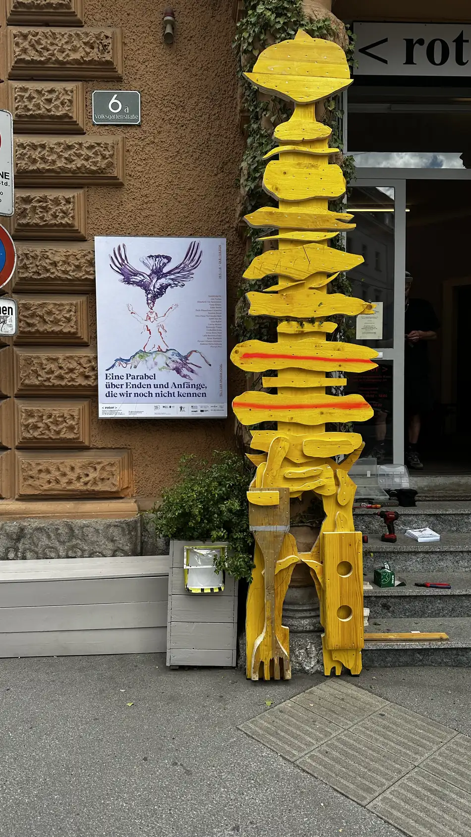 Echo Keepers 1 + 2 at the entrance of rotor, Graz, with the exhibition poster for A Parable for Endings and Beginnings We Don't Know Yet