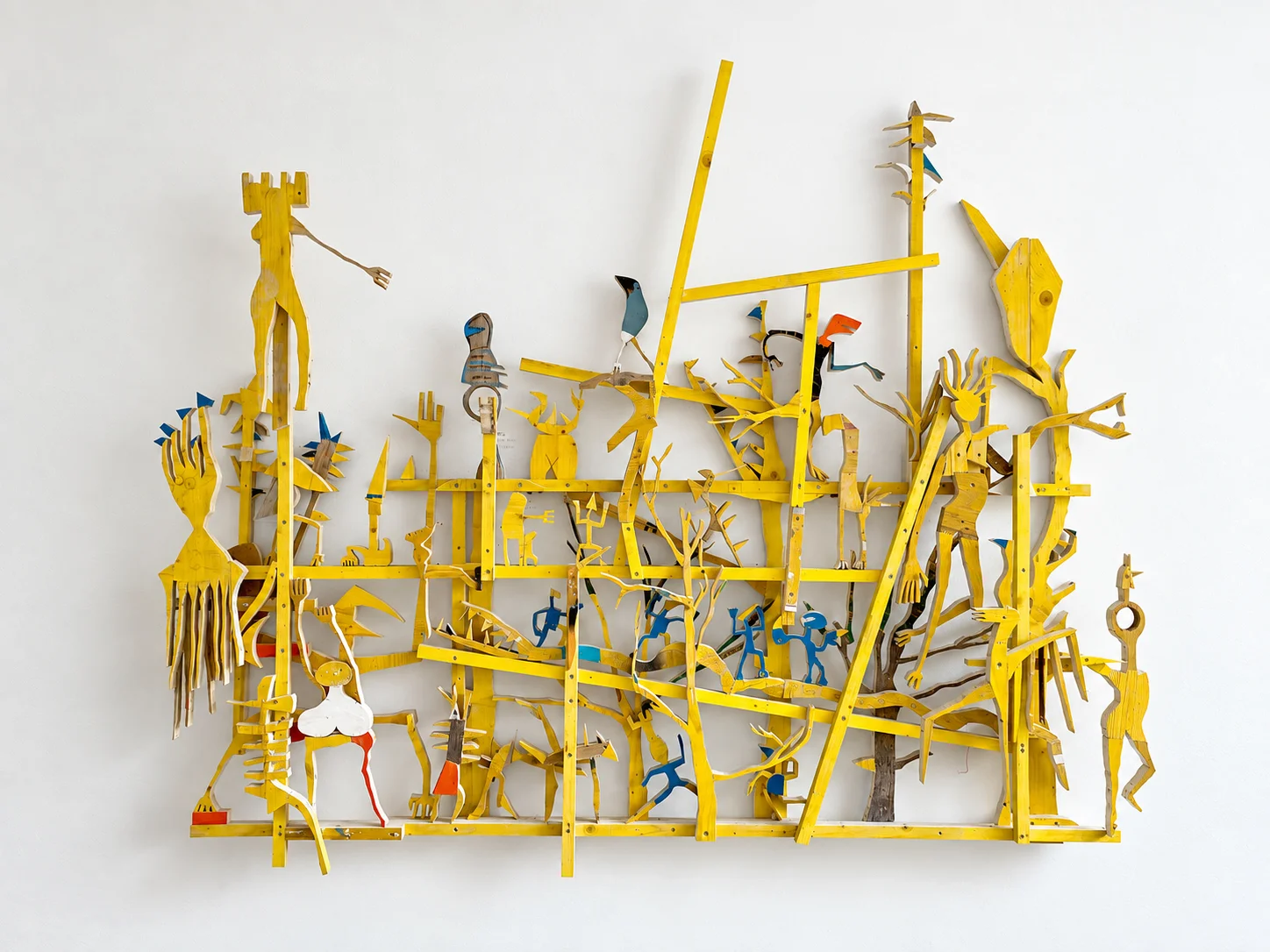 Large yellow wood wall sculpture in progress in the studio, 2024, Ernst Koslitsch