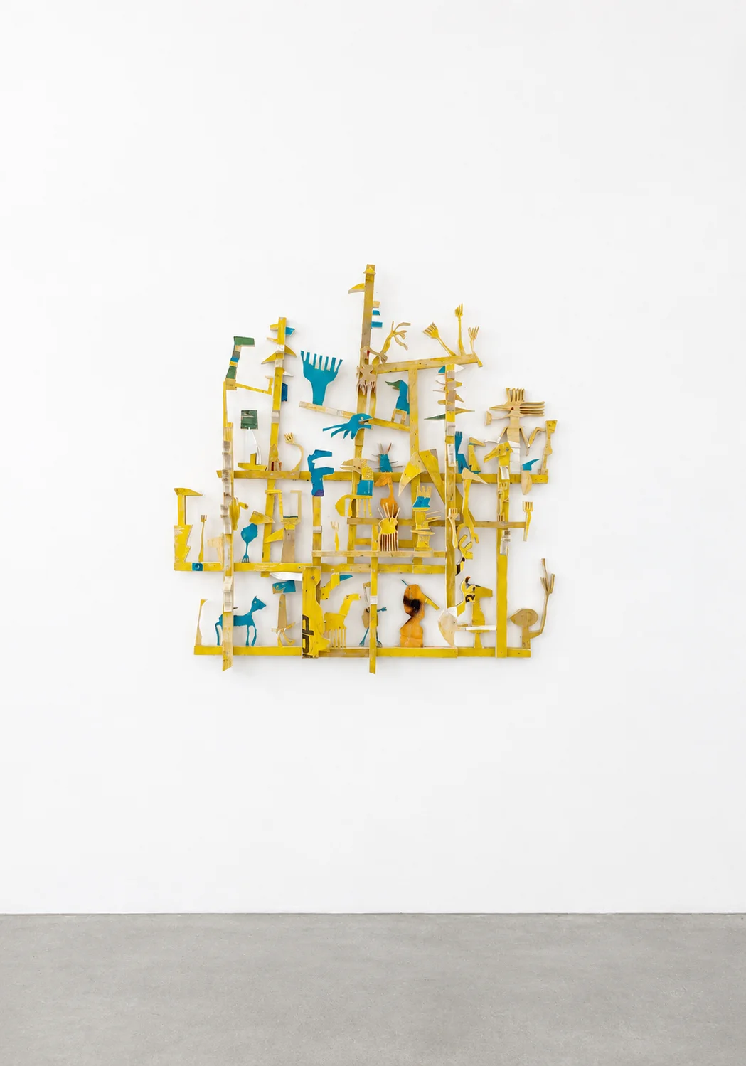 Hashtag Forever, yellow and blue wood grid sculpture with small figures, studio view, Ernst Koslitsch