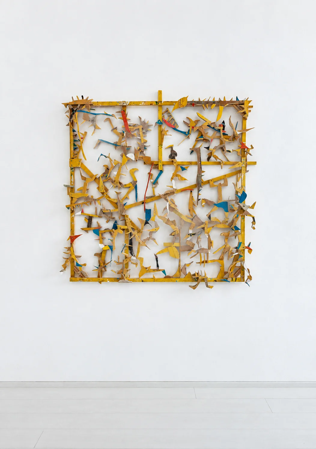 Razzle Dazzle, dense yellow wood grid sculpture with painted details, studio view, Ernst Koslitsch
