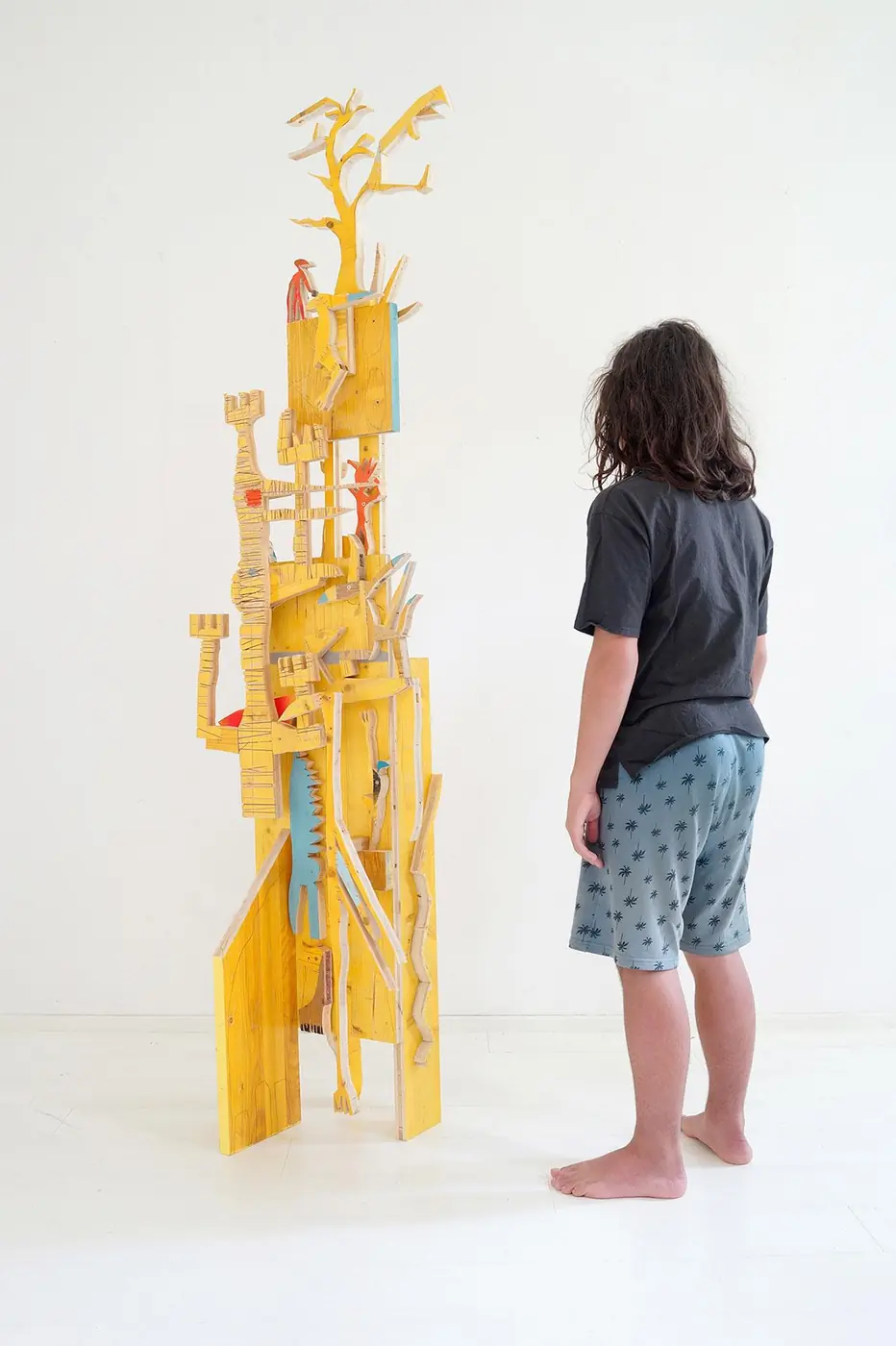 Displaced Artifact (Nr. 1), tall wood sculpture with figures, Vienna Contemporary